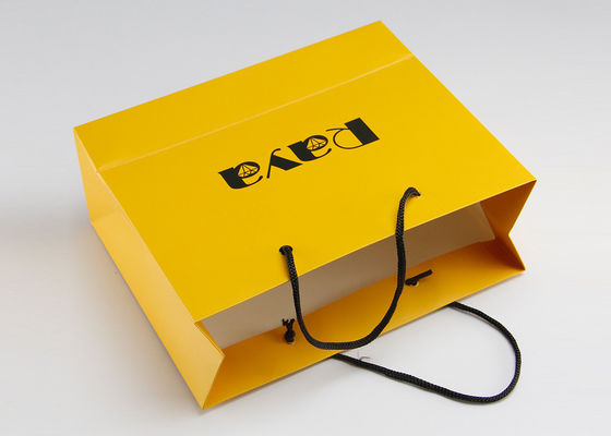 印刷される黄色い無光沢のペーパー買い物袋のナイロン ハンドルおよびカスタマイズされたロゴ