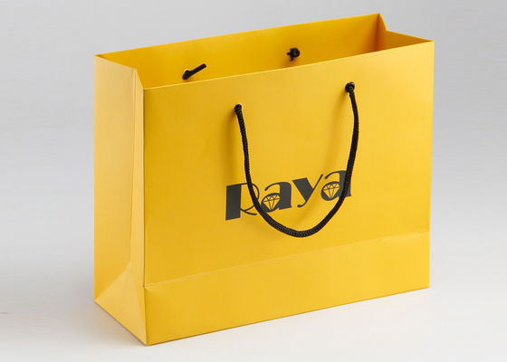印刷される黄色い無光沢のペーパー買い物袋のナイロン ハンドルおよびカスタマイズされたロゴ